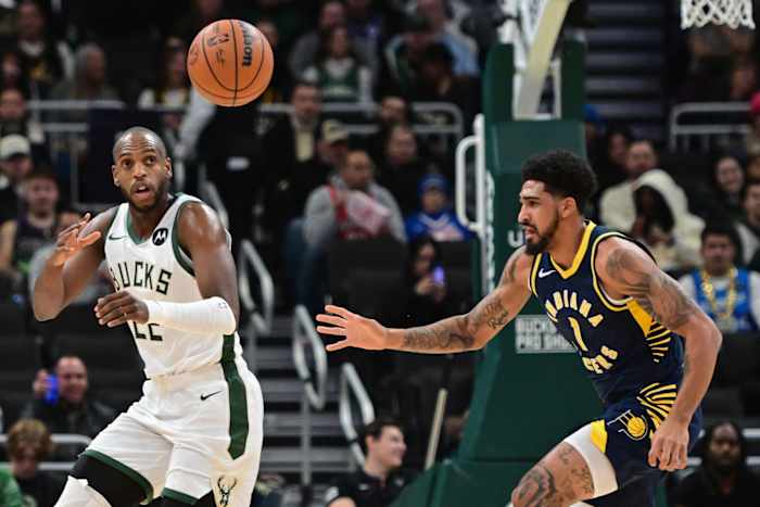 Milwaukee Bucks center Khris Middleton (22) receives a pass against Indiana Pacers forward Obi Toppin (1)
